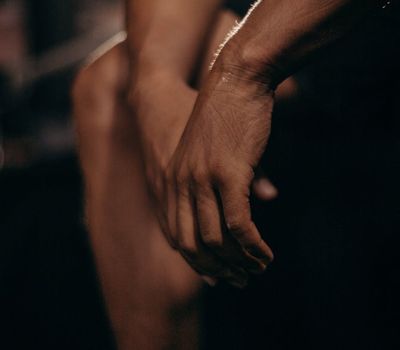 A detail shot of hands in a specific position during an exercise.