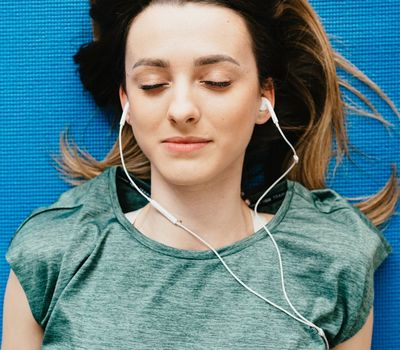 Empty yoga mat in a quiet, well-lit room suggesting tranquility.